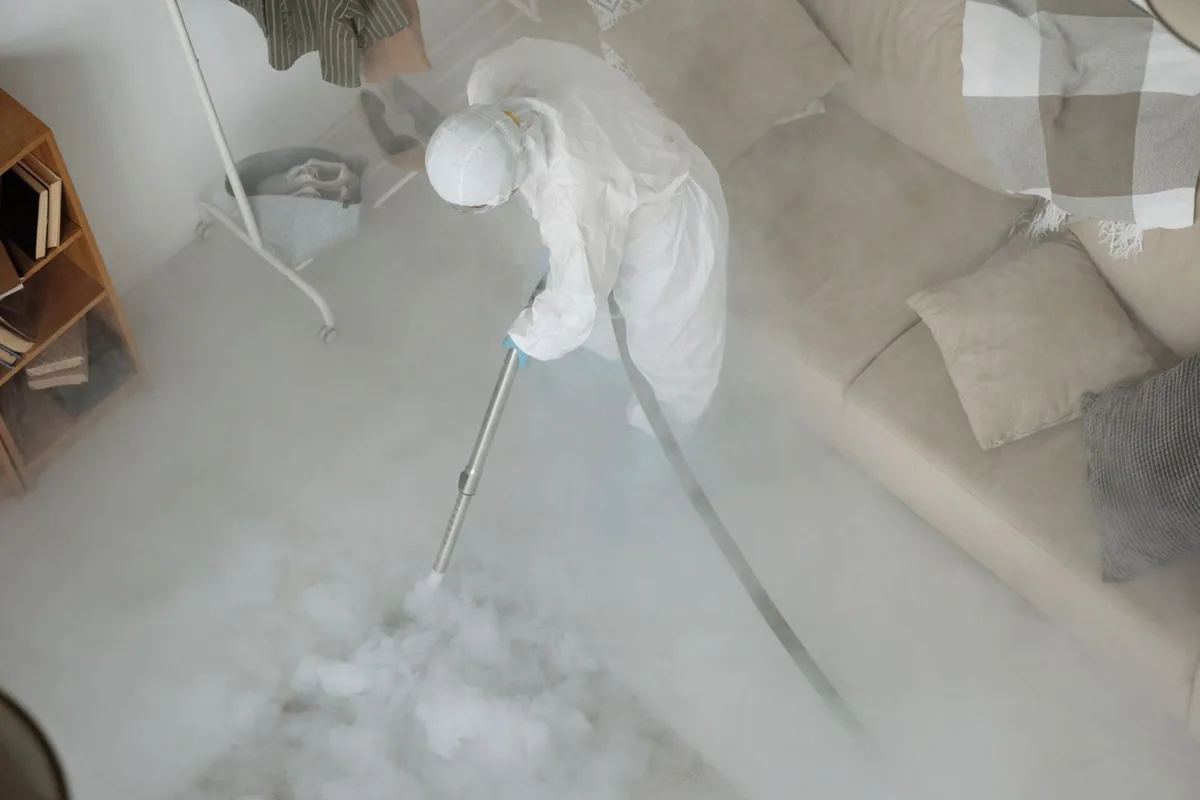 Biohazard cleanup technician in protective equipment, Maverick, San Antonio, TX